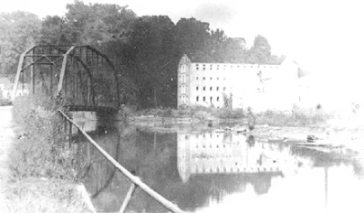 Warren Factory iron bridge 1922-1923: This bridge was built in place of the covered bridge that was destroyed in an 1895 flood. This image is part of the collection of historic photographs of Baltimore County, Maryland USA owned by the Baltimore County Public Library, Towson Maryland USA.