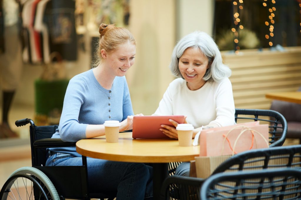 Family using tablet pc in cafe