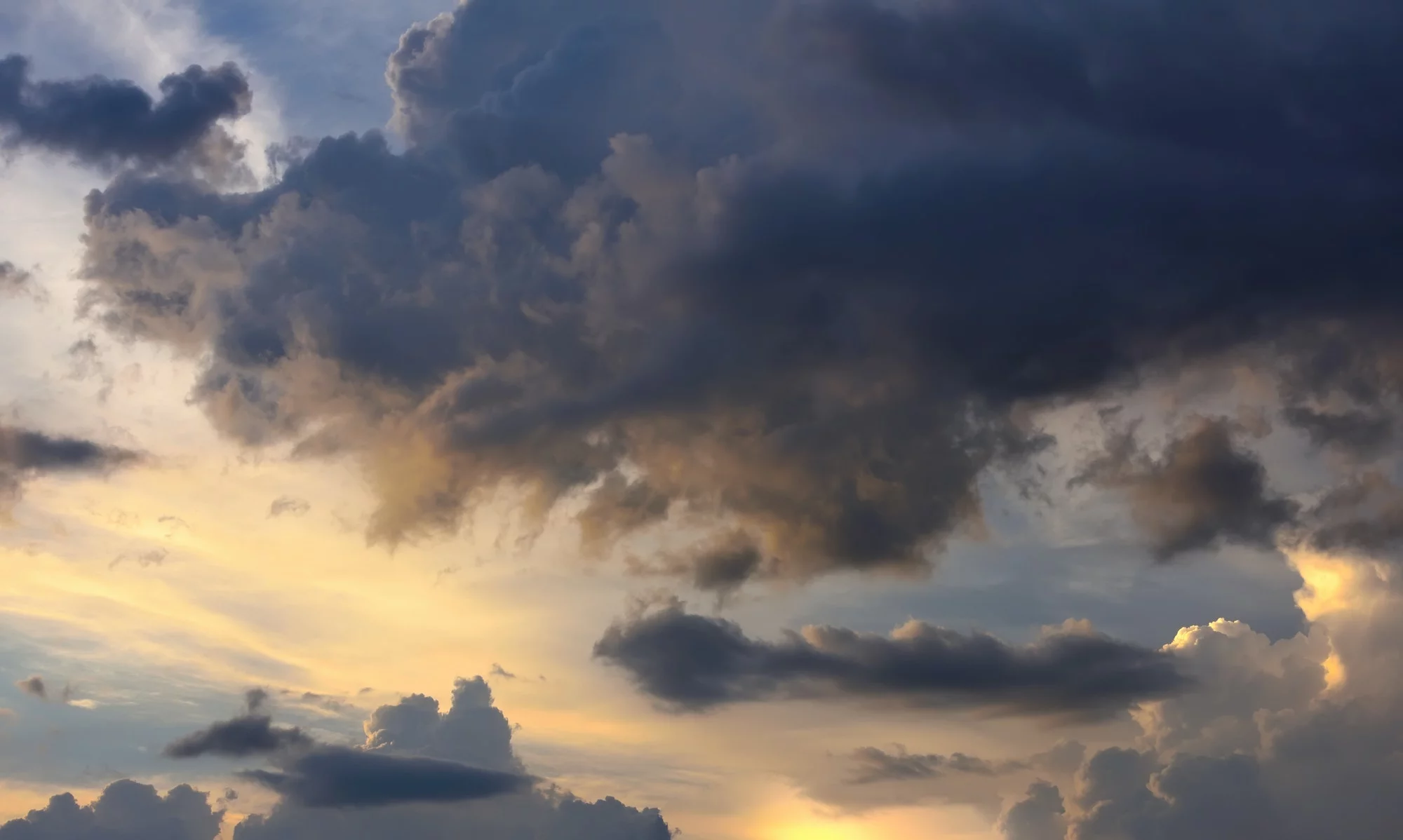 Fantastic view of the dark overcast sky. Picturesque sunset with