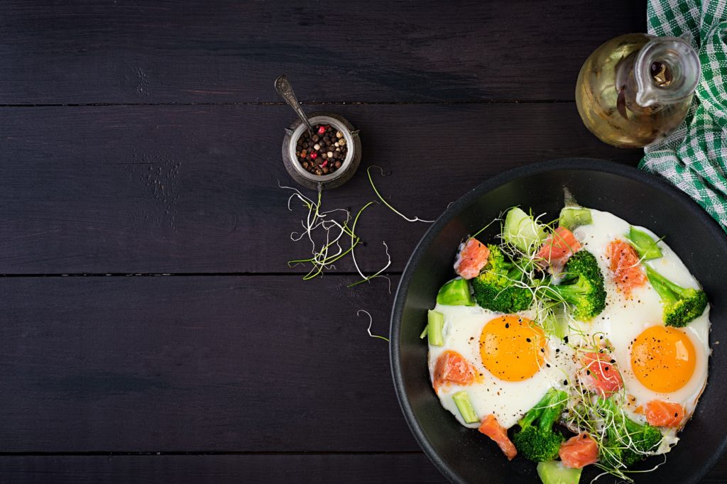 Ketogenic/paleo diet. Fried eggs, salmon, broccoli and microgreen.