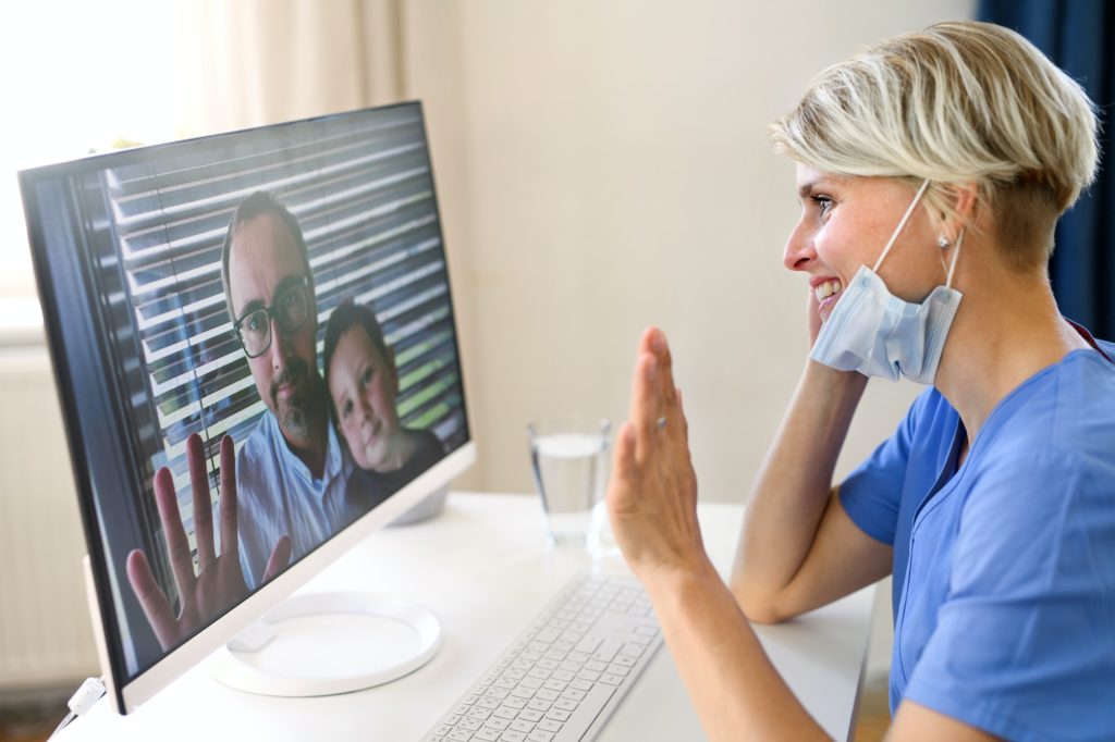 Woman doctor having video call with patients on laptop, online consultation concept