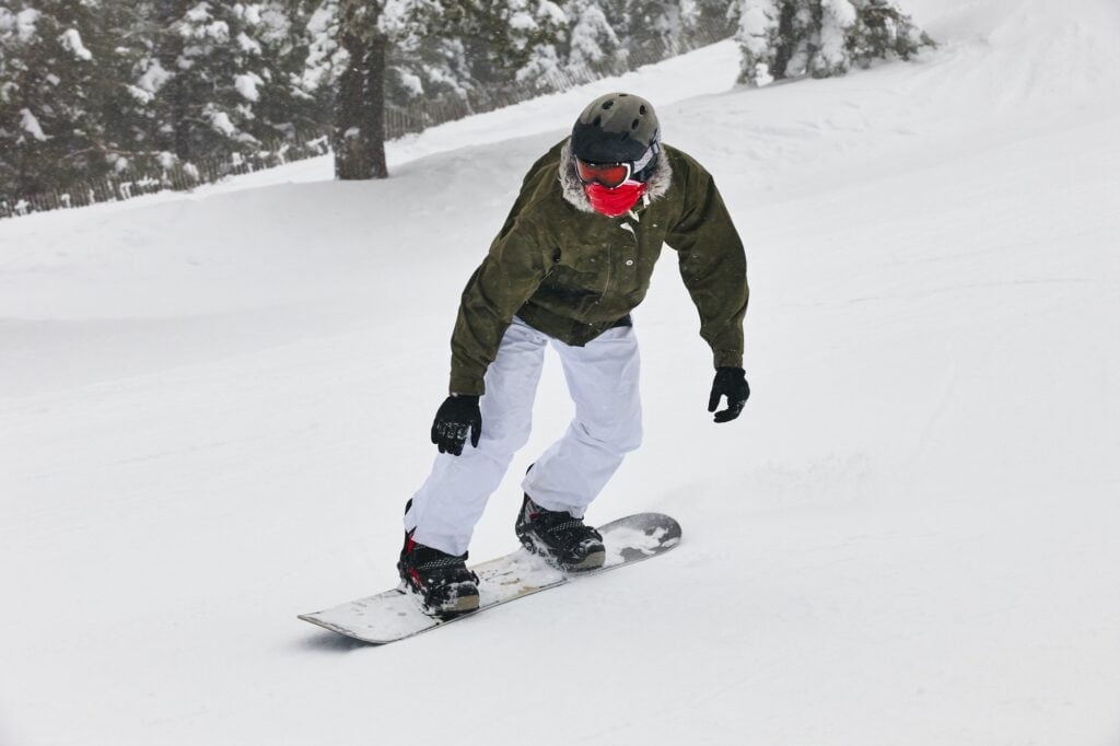 Snowboarding on a snow forest landscape. Winter sport. Horizontal